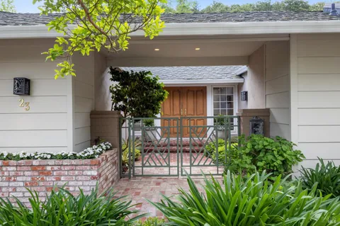 a front view of a house with garden