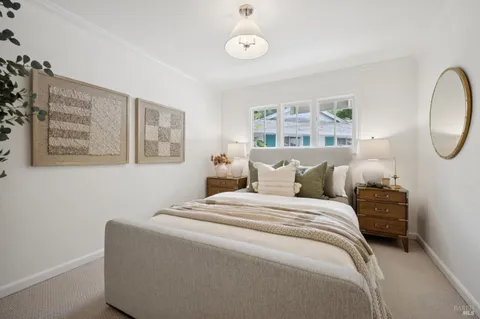 a bed room with a bed and a chair