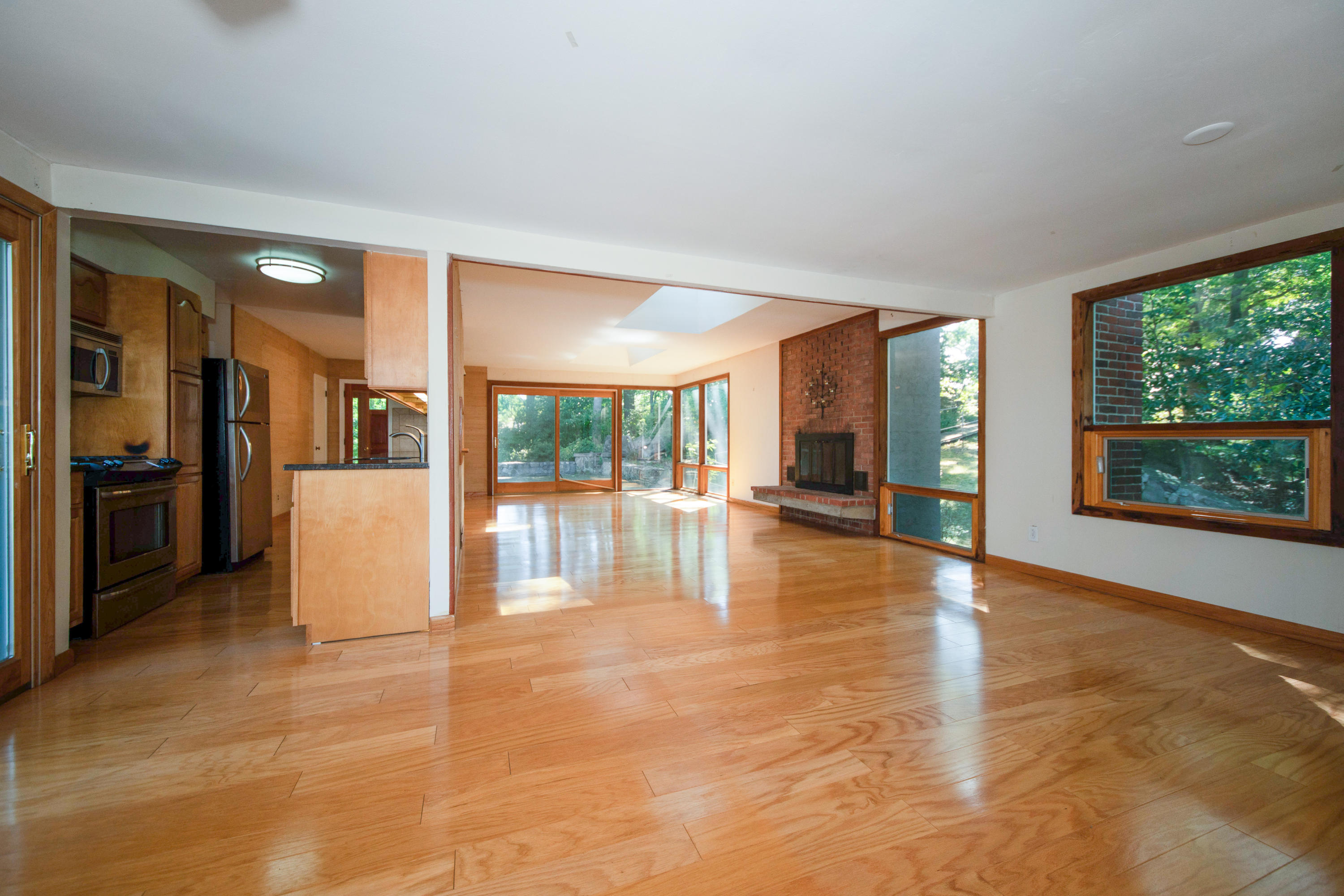 30 Splitrock Road Norwalk, CT 06854 - Photo 7 of 19 a view of an empty room with large windows