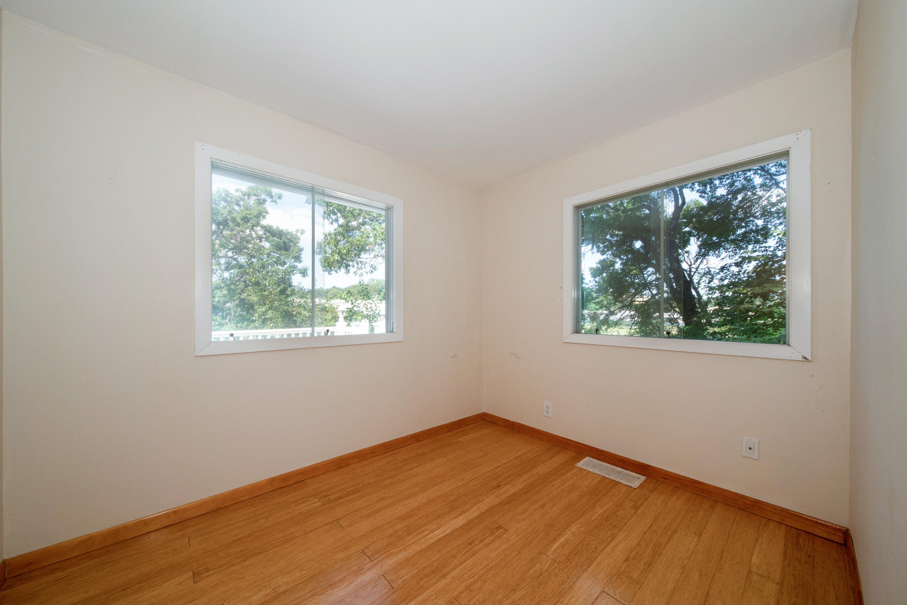 30 Splitrock Road Norwalk, CT 06854 - Photo 9 of 19 an empty room with wooden floor and windows
