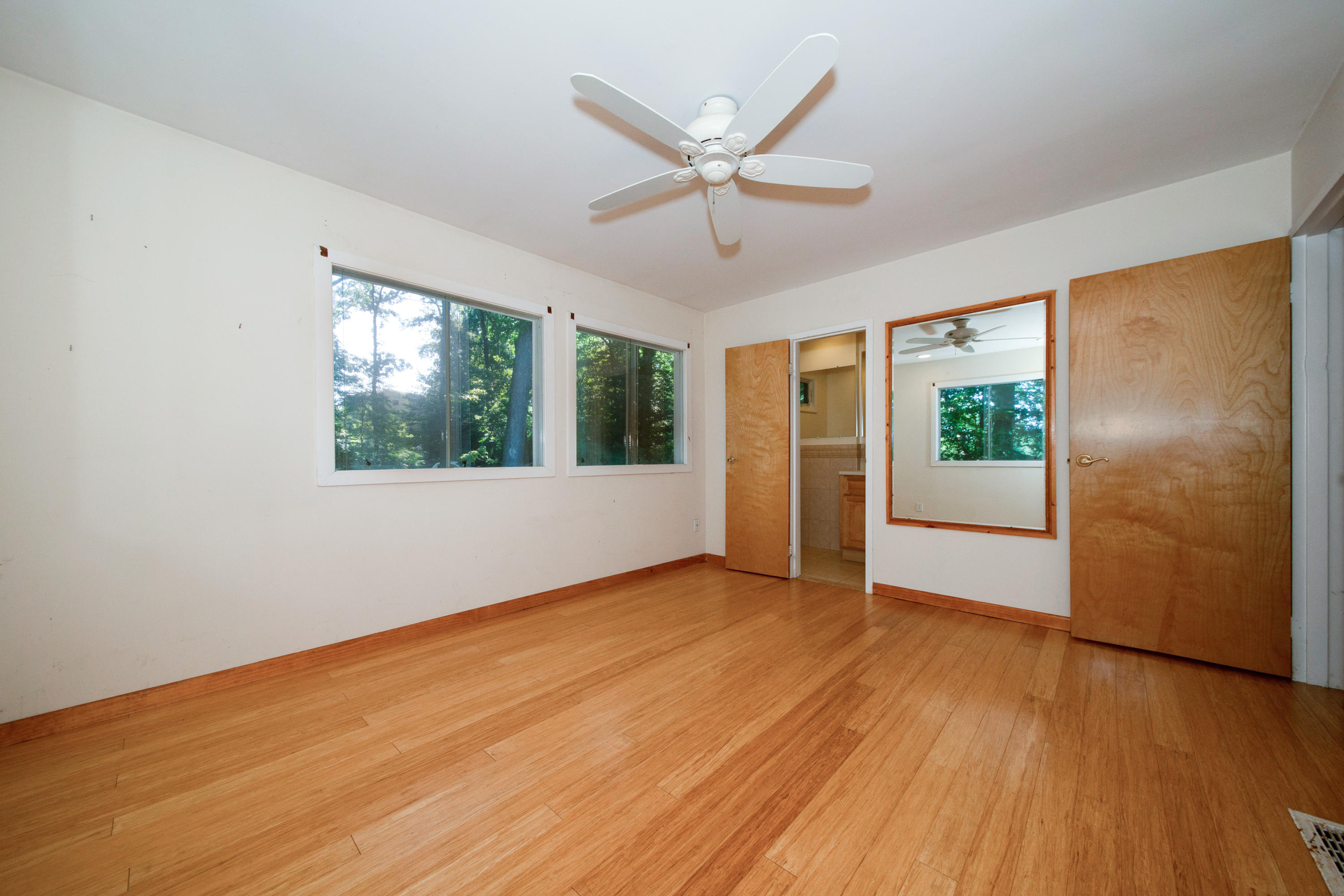 30 Splitrock Road Norwalk, CT 06854 - Photo 10 of 19 a view of an empty room with a window and wooden floor
