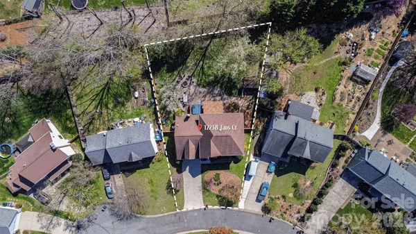 an aerial view of houses with yard