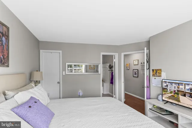 a bedroom with furniture and a window