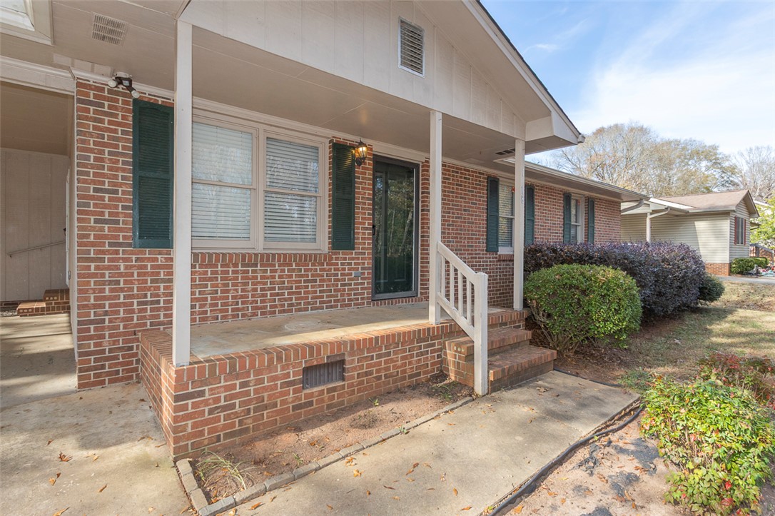 1118 Gilreath Road Anderson, SC 29621 - Photo 2 of 18 This classic brick residence features a welcoming covered front porch, perfect for enjoying the outdoors.