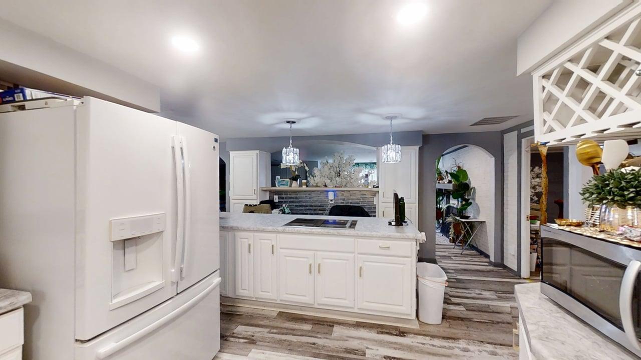 23 Greenridge Drive Decatur, IL 62526 - Photo 11 of 42 a kitchen with granite countertop a refrigerator and a stove