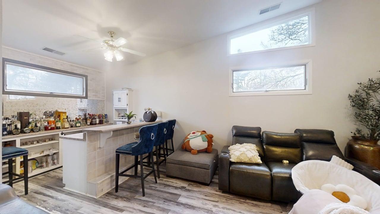 23 Greenridge Drive Decatur, IL 62526 - Photo 14 of 42 a living room with furniture and a chandelier