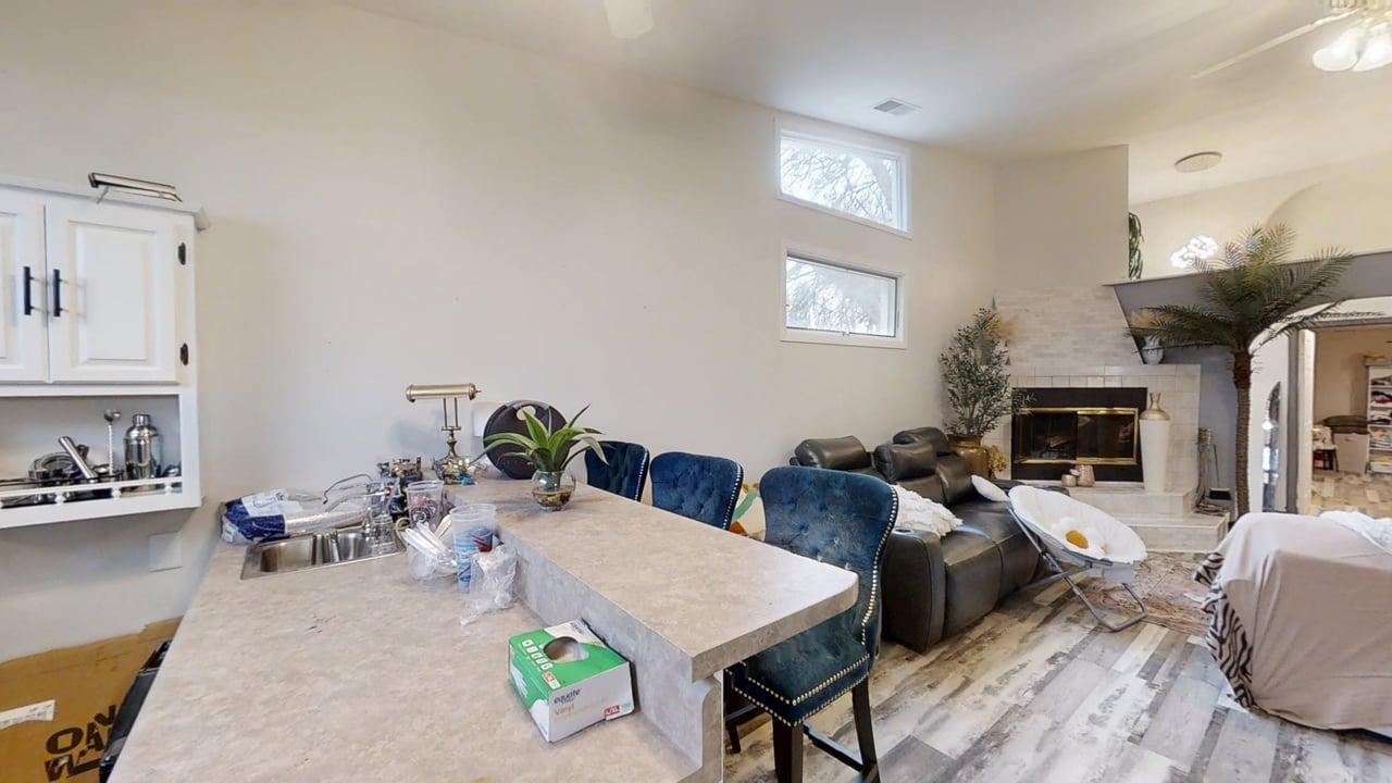 23 Greenridge Drive Decatur, IL 62526 - Photo 15 of 42 a living room with furniture a fireplace and a flat screen tv