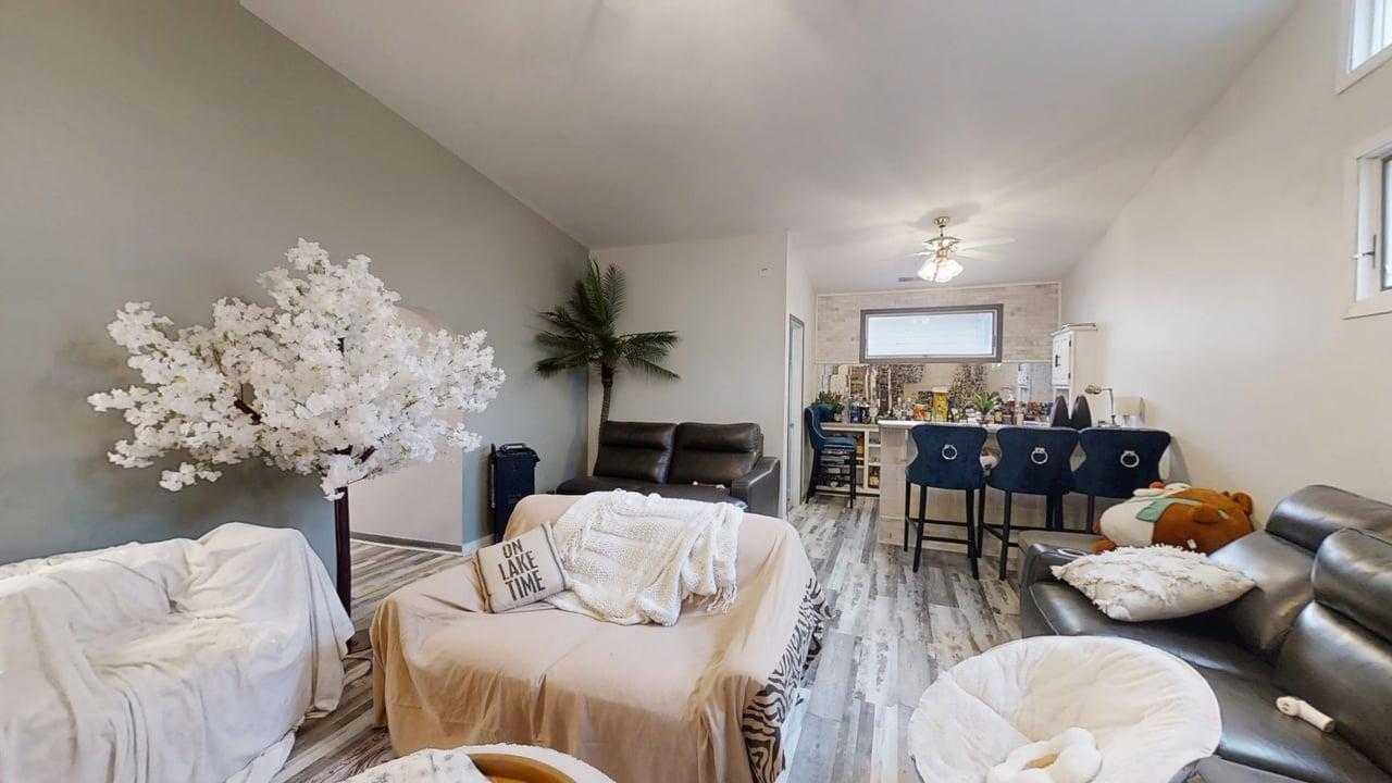 23 Greenridge Drive Decatur, IL 62526 - Photo 17 of 42 a living room with furniture and a chandelier