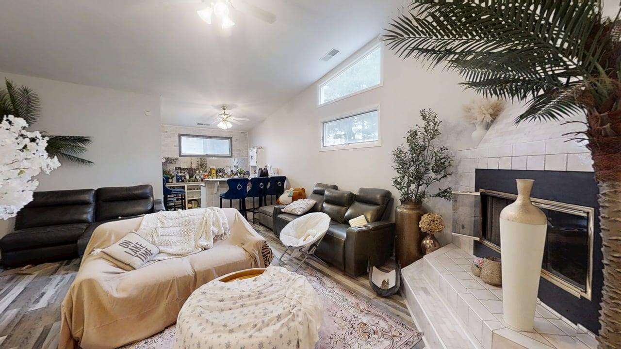 23 Greenridge Drive Decatur, IL 62526 - Photo 18 of 42 a living room with furniture a fireplace and a potted plant