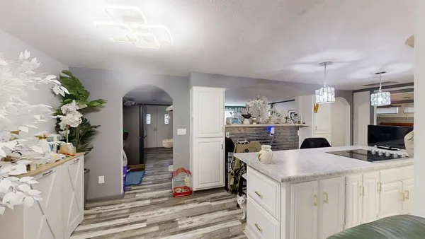 a kitchen with a sink stove and refrigerator