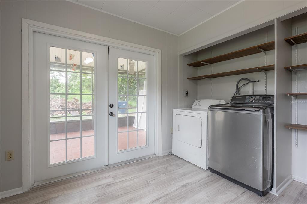 10411 North Woodmere Road Tampa, FL 33617 - Photo 15 of 29 a view of a kitchen with a sink dishwasher and a refrigerator