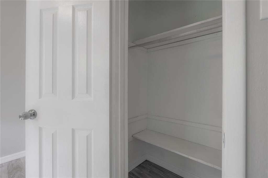 10411 North Woodmere Road Tampa, FL 33617 - Photo 21 of 29 a view of a room with white door