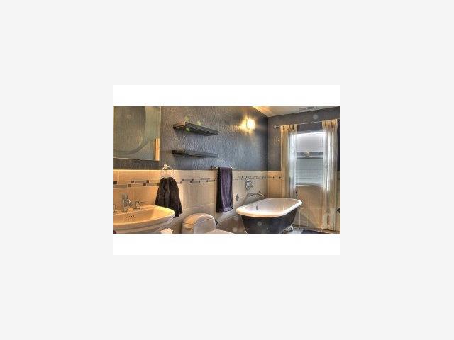 14505 Oka Road Los Gatos, CA 95032 - Photo 7 of 9 a picture of a bathroom with a sink and mirror