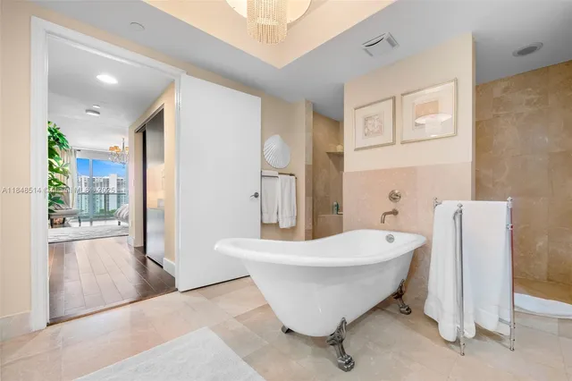 a spacious bathroom with a bathtub and shower