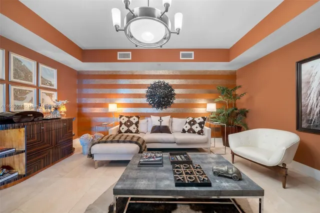 a living room with furniture and a lamp