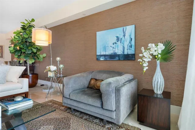 a living room with furniture flowerpot and a potted plant