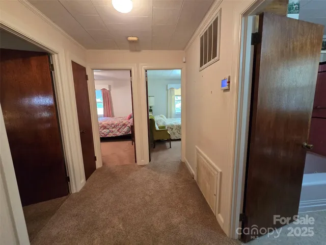 a view of hallway with livingroom and bedroom