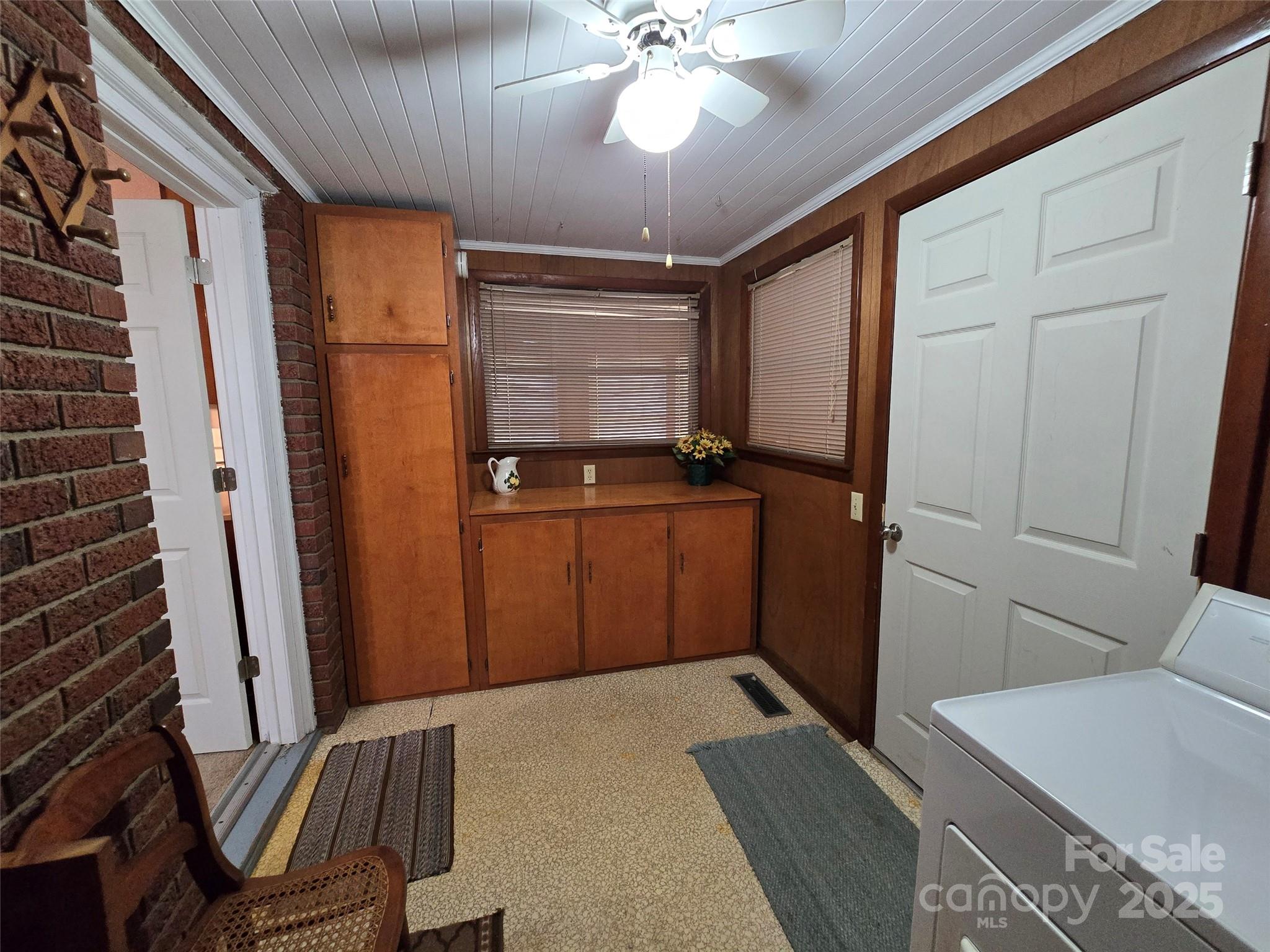 517 Mask Road Mount Gilead, NC 27306 - Photo 23 of 48 a bedroom with a bed and a chandelier