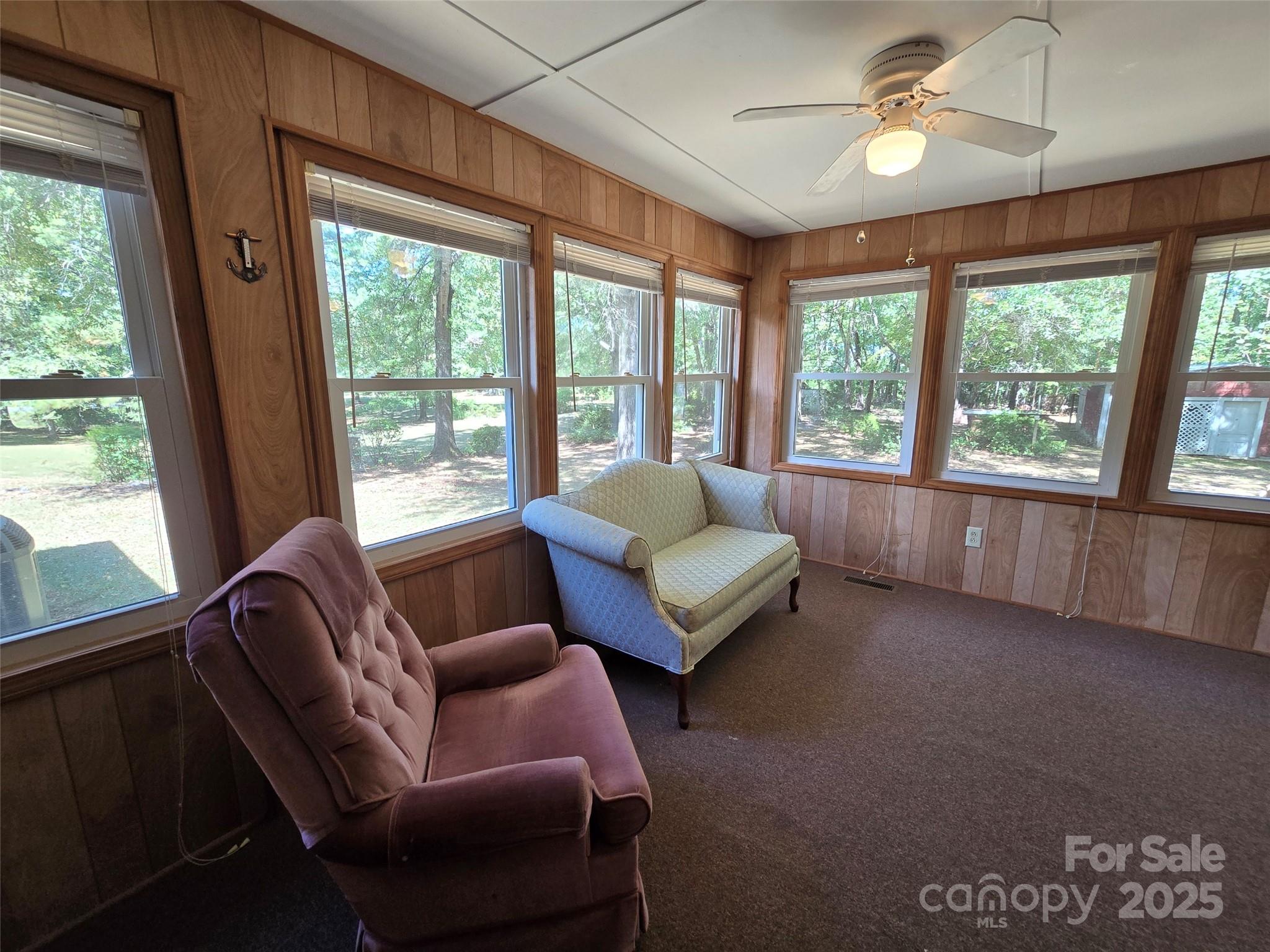 517 Mask Road Mount Gilead, NC 27306 - Photo 25 of 48 a living room with furniture and a large window