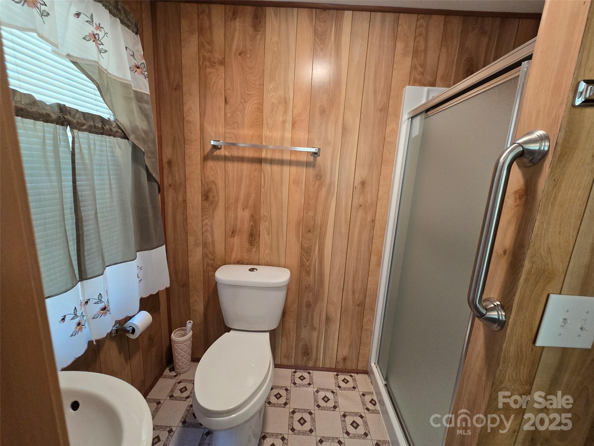 517 Mask Road Mount Gilead, NC 27306 - Photo 29 of 48 a white toilet sitting next to a small bathroom