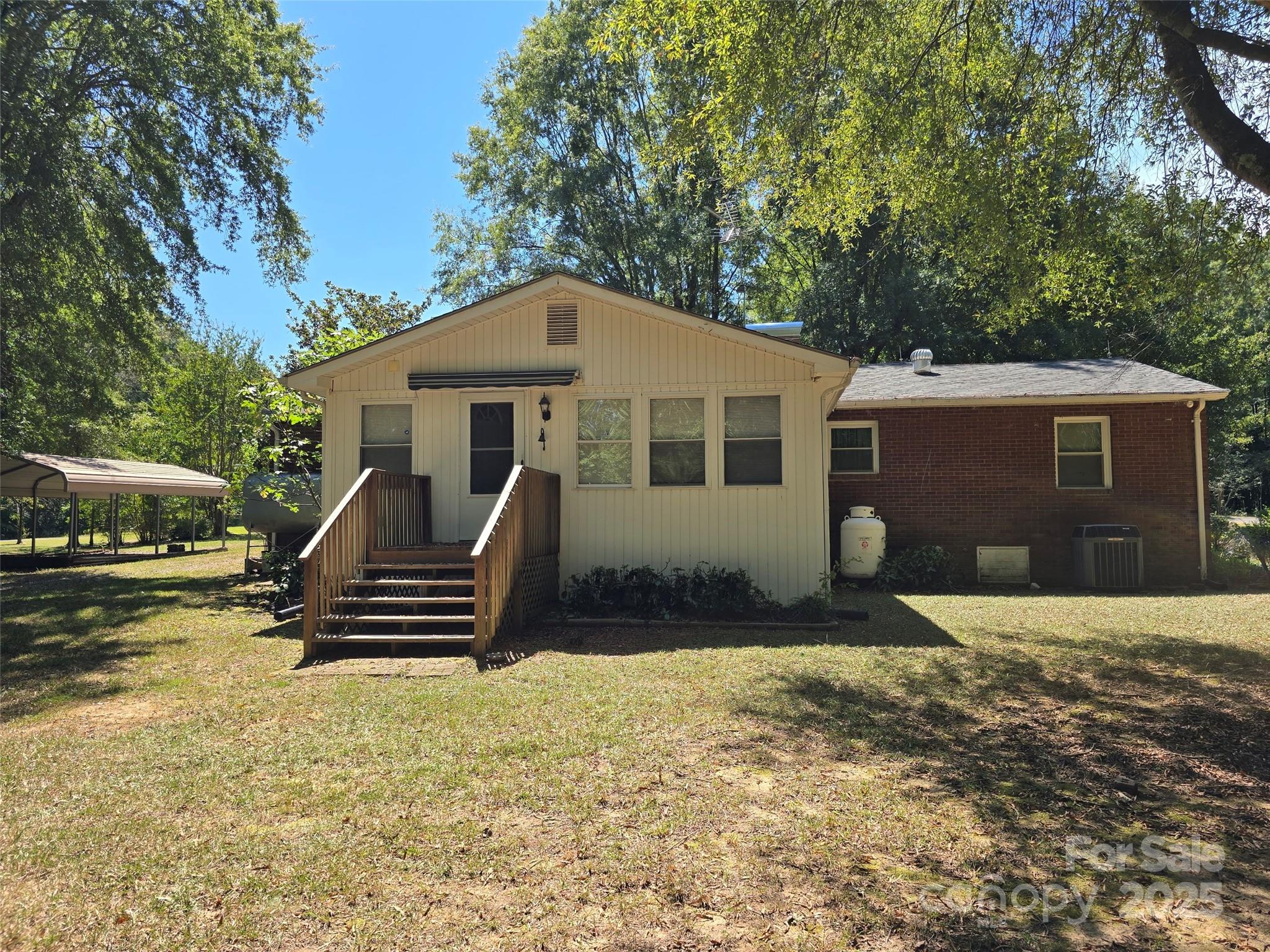 517 Mask Road Mount Gilead, NC 27306 - Photo 35 of 48 a front view of a house with garden