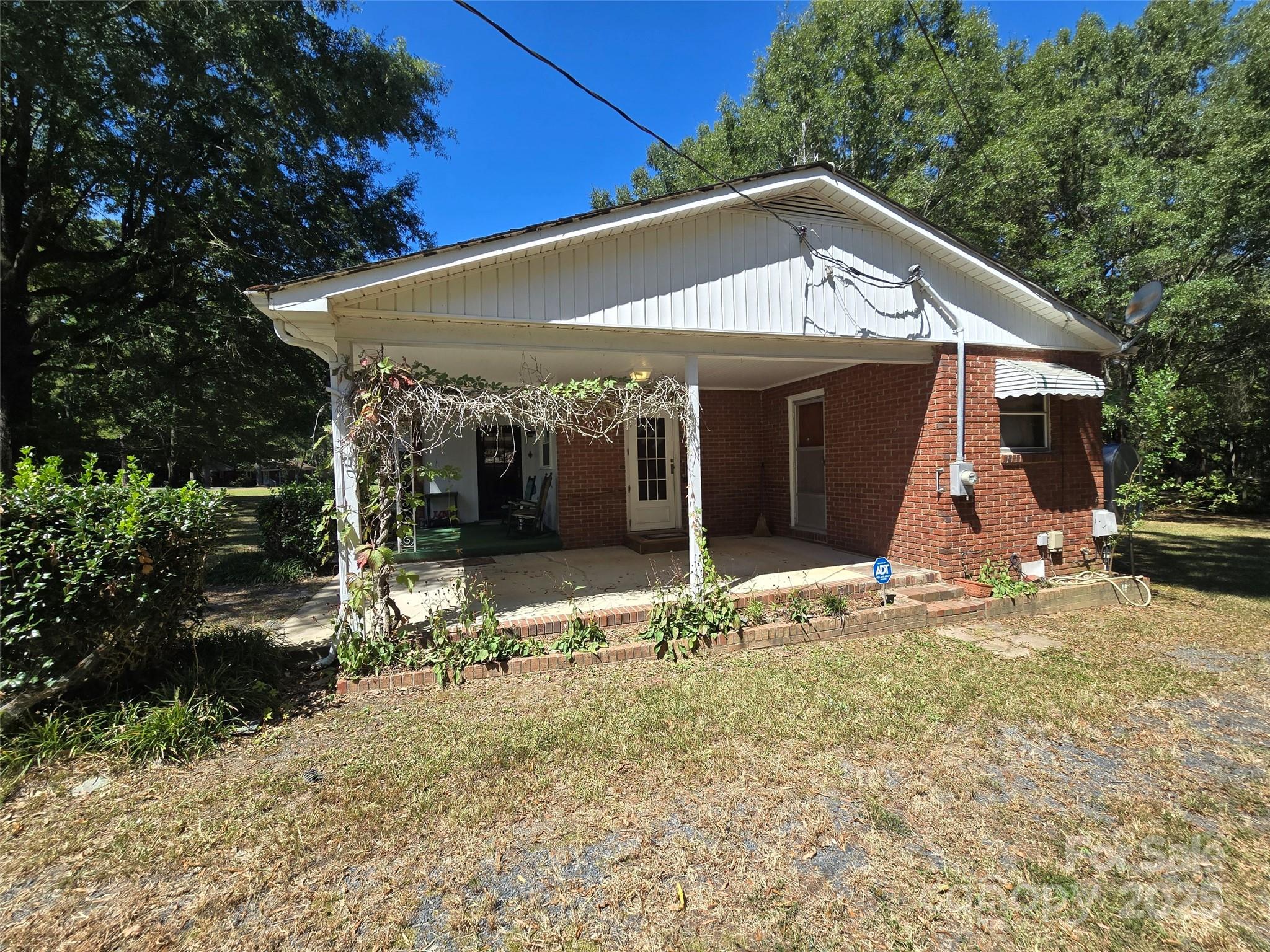 517 Mask Road Mount Gilead, NC 27306 - Photo 39 of 48 a view of a house with backyard porch and sitting area