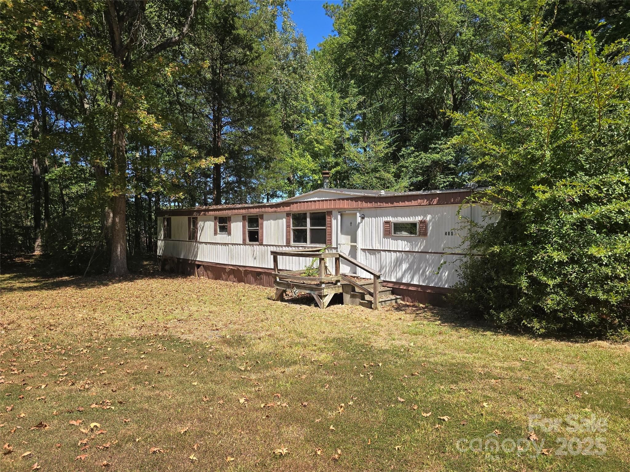 517 Mask Road Mount Gilead, NC 27306 - Photo 46 of 48 a house with trees in front of it