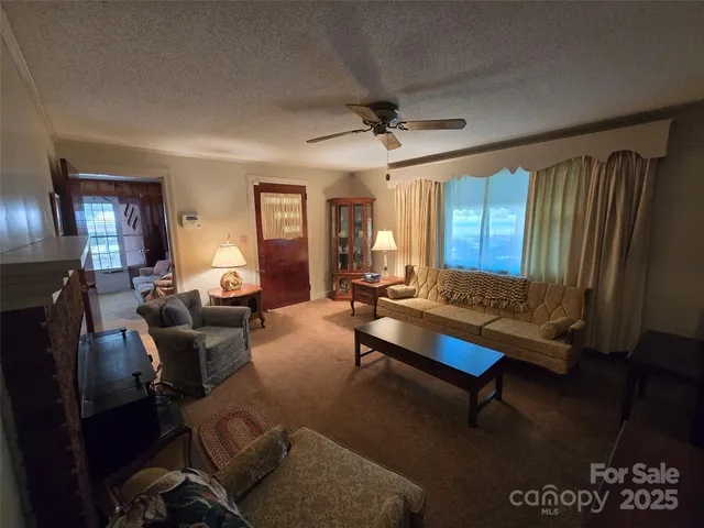 a living room with furniture rug and window