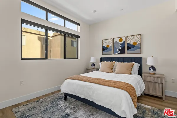 a bedroom with a bed and a bathroom