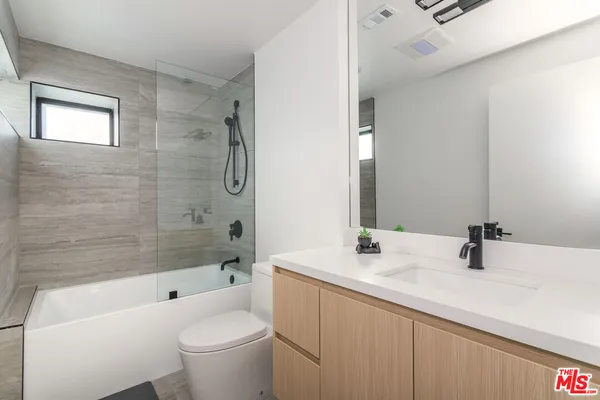 a view of a hallway with washer and dryer