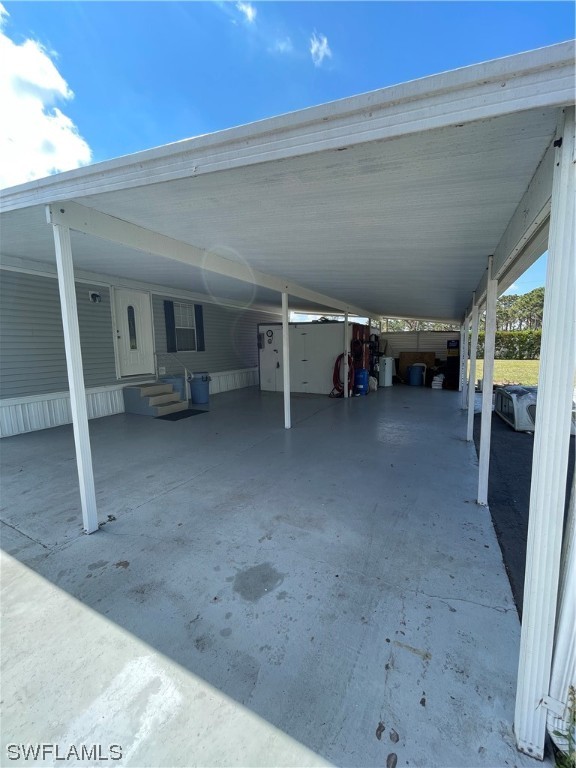 20560 Holiday Drive Estero, FL 33928 - Photo 16 of 33 a view of a big room with closet area and a window
