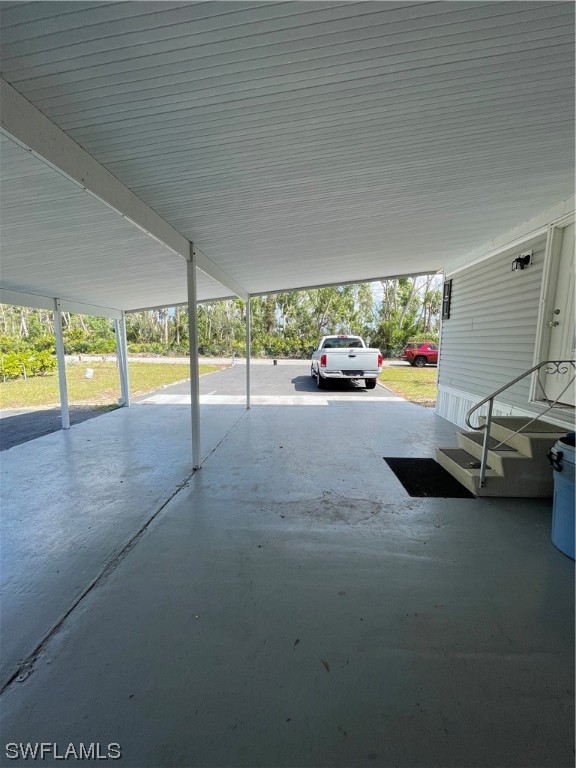 20560 Holiday Drive Estero, FL 33928 - Photo 17 of 33 a view of a swimming pool with an outdoor seating
