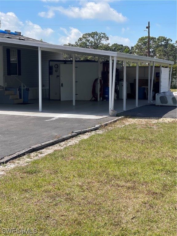 20560 Holiday Drive Estero, FL 33928 - Photo 18 of 33 a view of a house with a yard