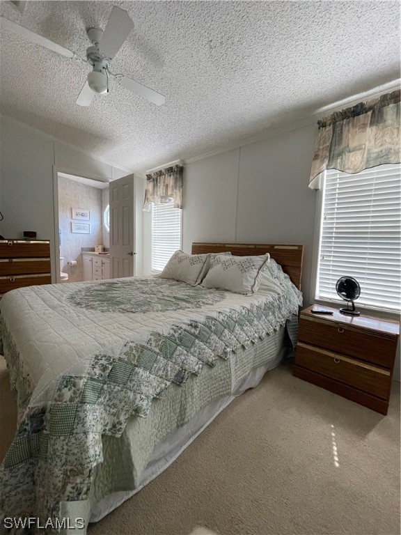 20560 Holiday Drive Estero, FL 33928 - Photo 19 of 33 a bedroom with a bed and window