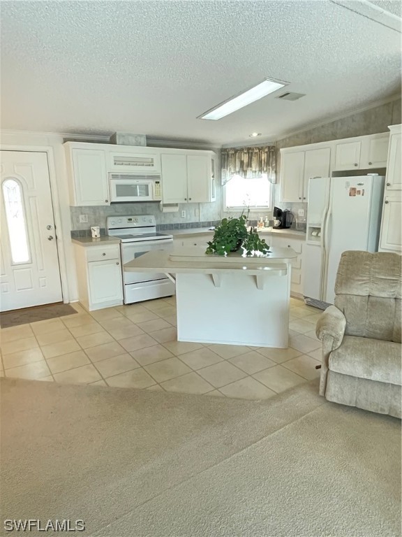 20560 Holiday Drive Estero, FL 33928 - Photo 24 of 33 a living room with stainless steel appliances furniture and a kitchen view