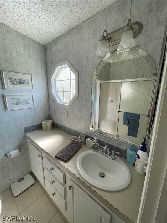 20560 Holiday Drive Estero, FL 33928 - Photo 28 of 33 a bathroom with a sink and a mirror