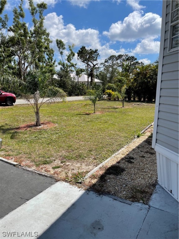 20560 Holiday Drive Estero, FL 33928 - Photo 3 of 33 a view of a yard with an outdoor space