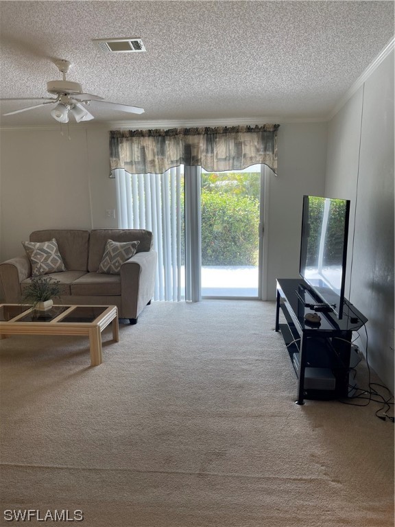 20560 Holiday Drive Estero, FL 33928 - Photo 31 of 33 a living room with furniture and a flat screen tv