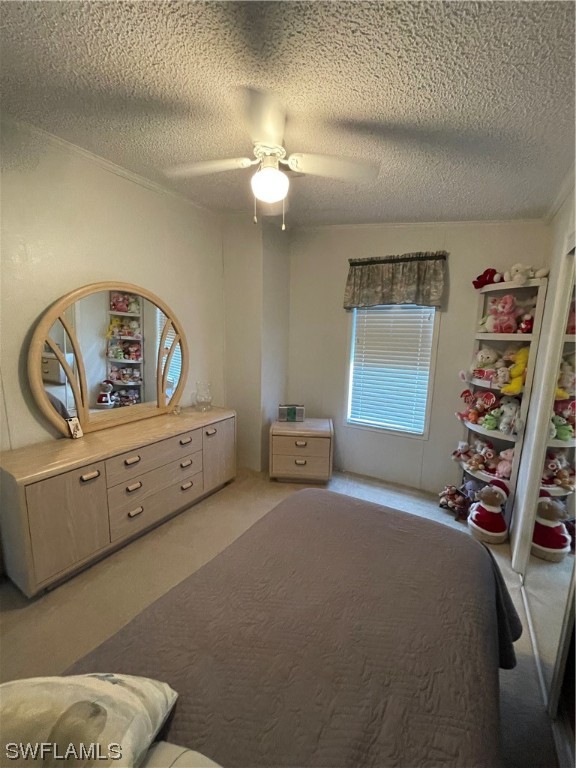 20560 Holiday Drive Estero, FL 33928 - Photo 32 of 33 a bedroom with a bed and a bookshelf