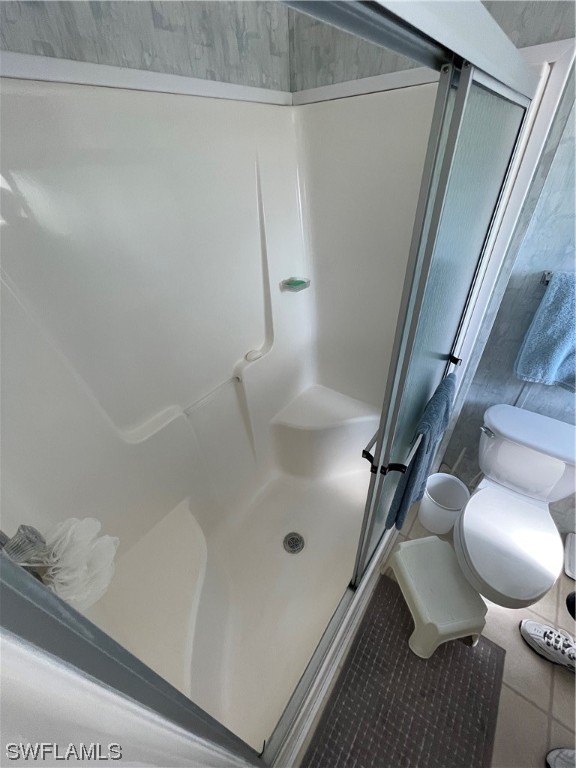 20560 Holiday Drive Estero, FL 33928 - Photo 8 of 33 a bathroom with a sink and mirror