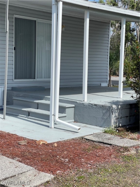 20560 Holiday Drive Estero, FL 33928 - Photo 9 of 33 a view of house with backyard and porch