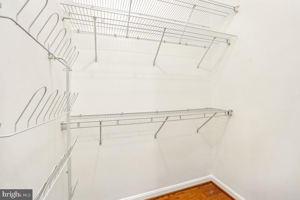 14809 Pennfield Circle, Unit 105 Silver Spring, MD 20906 - Photo 19 of 29 a view of a room with racks on the wall