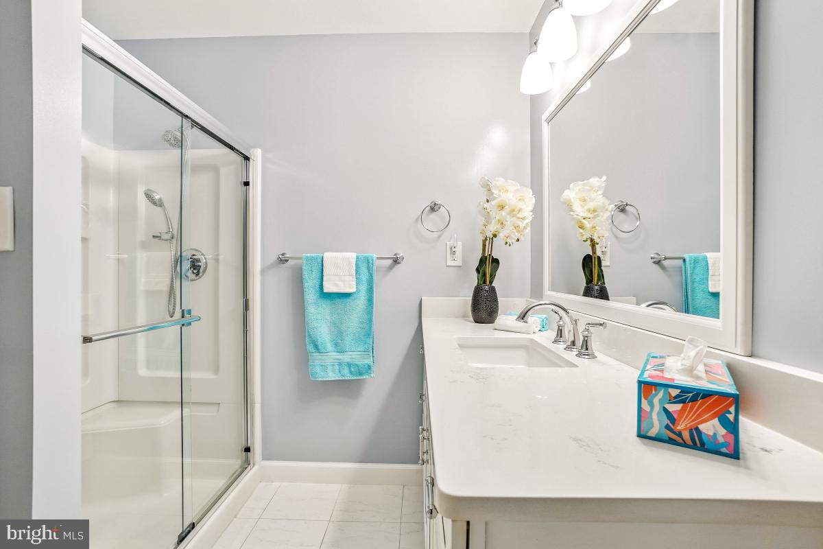14809 Pennfield Circle, Unit 105 Silver Spring, MD 20906 - Photo 21 of 29 a bathroom with a sink and a mirror