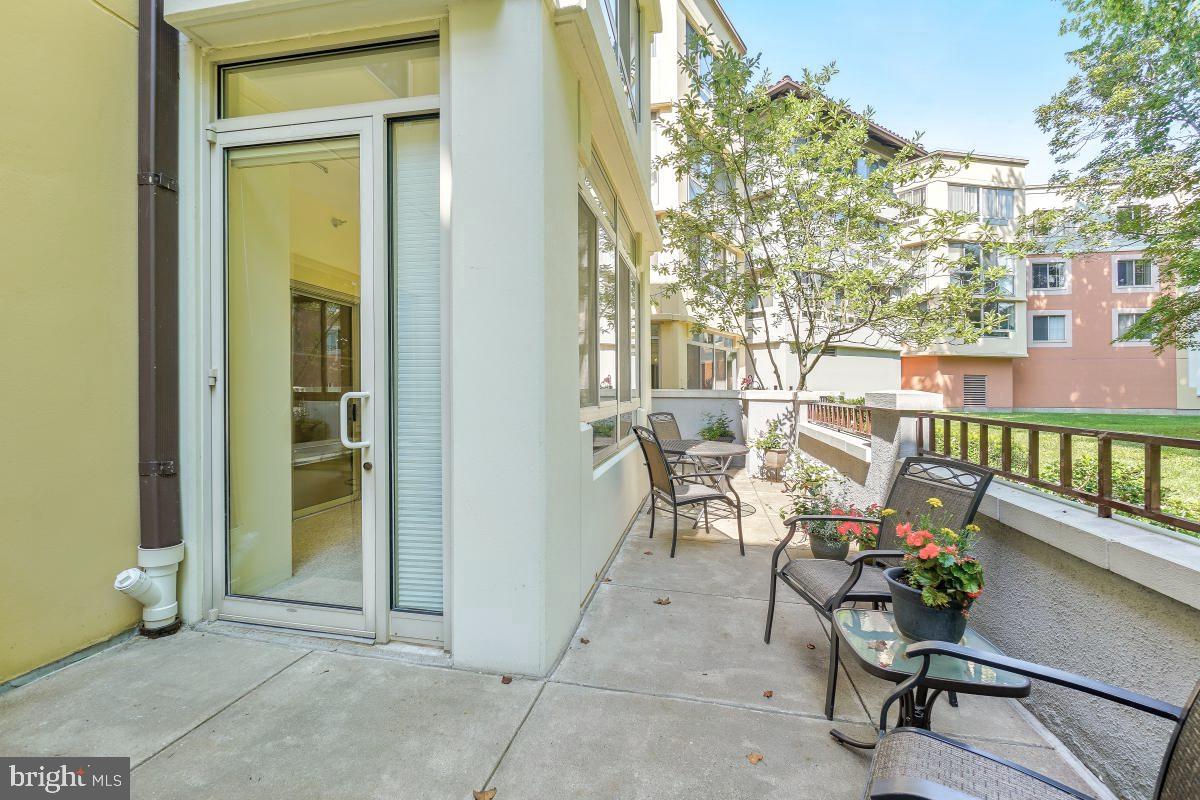 14809 Pennfield Circle, Unit 105 Silver Spring, MD 20906 - Photo 7 of 29 a view of a balcony with chairs