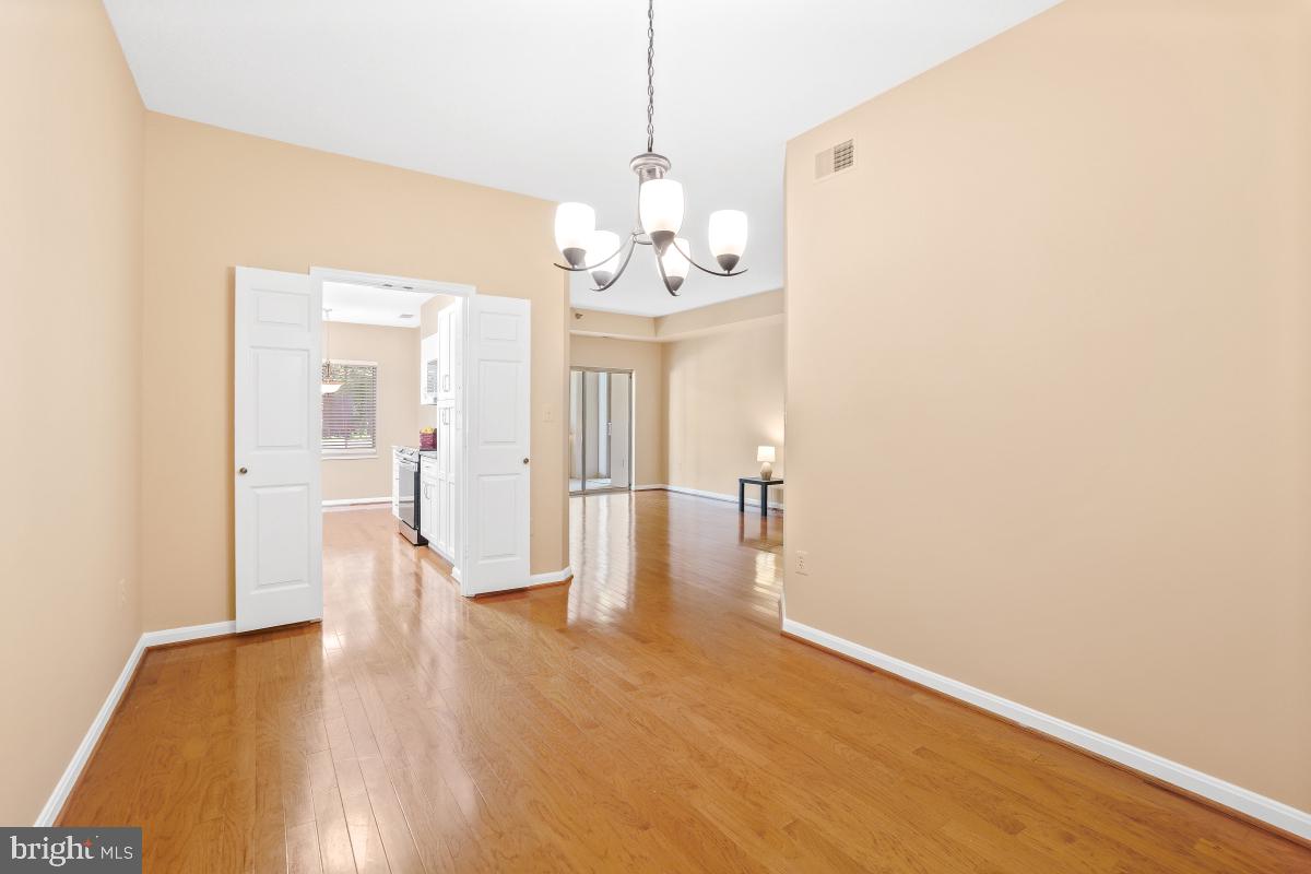 14809 Pennfield Circle, Unit 105 Silver Spring, MD 20906 - Photo 10 of 29 a view of a hallway with wooden floor