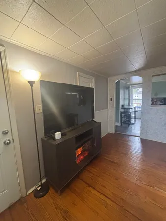 a living room with furniture rug and window
