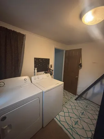 a bedroom with a bed and a tv on the dresser