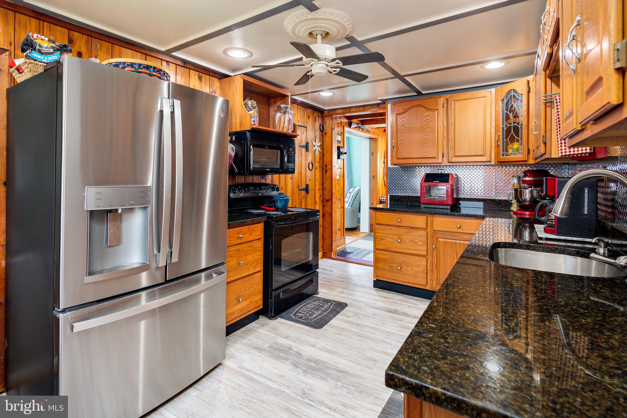 325 Main Street Delta, PA 17314 - Photo 13 of 41 a kitchen with stainless steel appliances granite countertop a refrigerator and a stove