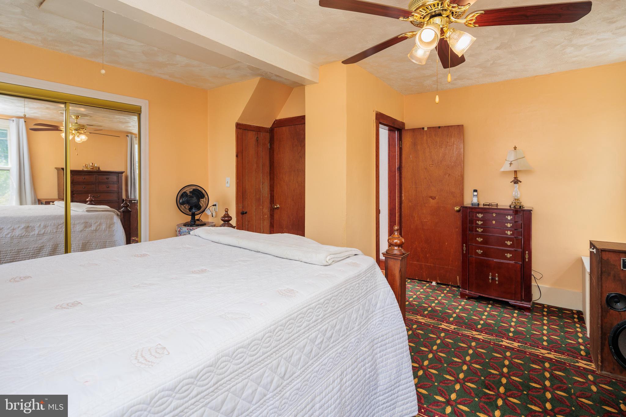 325 Main Street Delta, PA 17314 - Photo 23 of 41 a bedroom with a bed and a chandelier