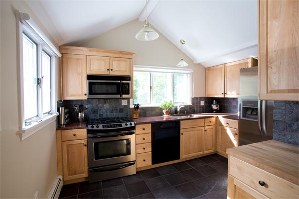 a kitchen with a stove and a microwave